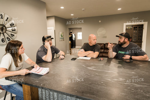 Farmers Review Seed Orders in Farm Office on Phone 7625