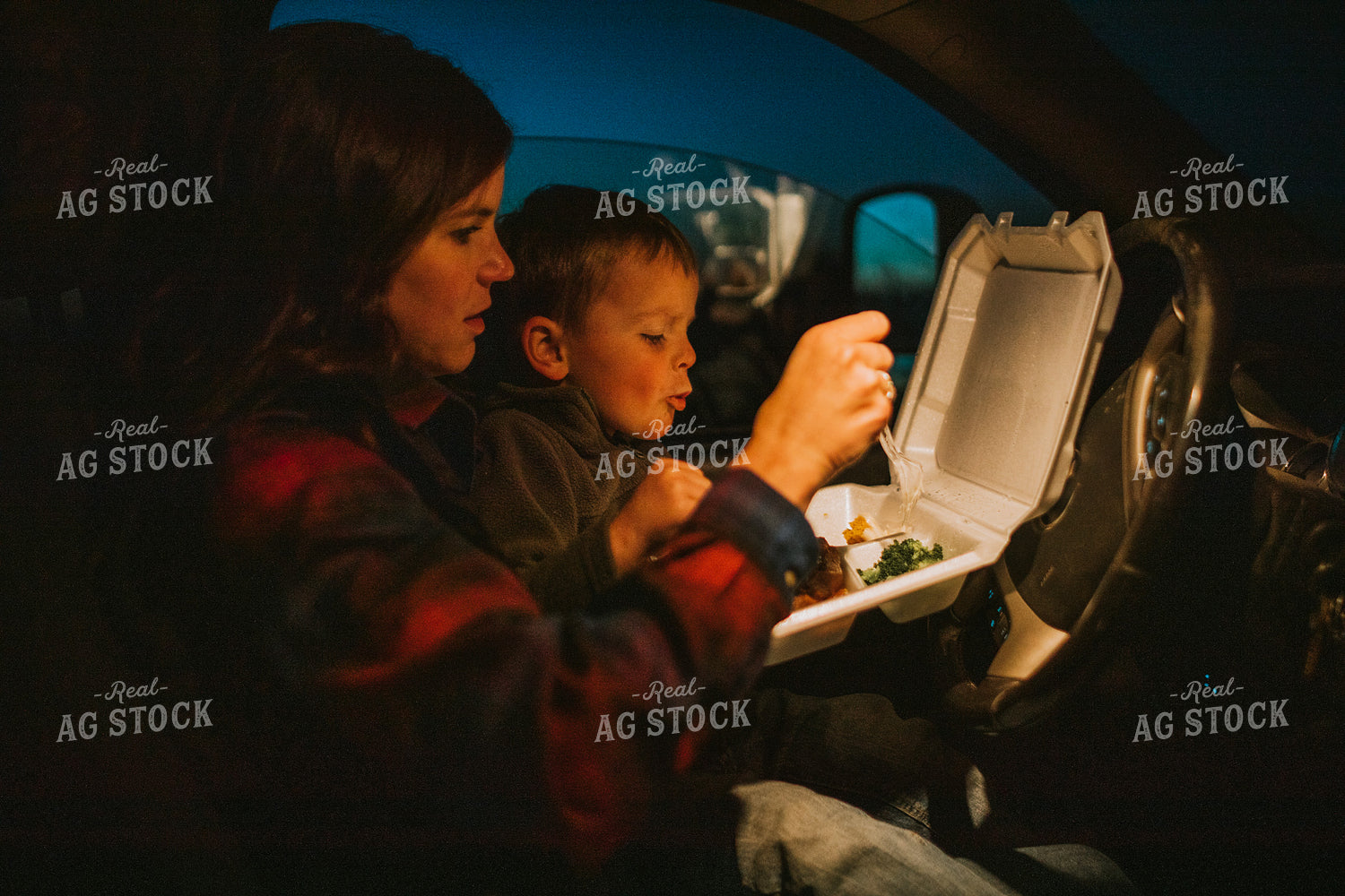 Farm Mom and Farm Kid Eating Field Meal in Truck at Night 5156