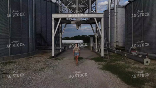Farm Wife Walking by Grain Bin 9163