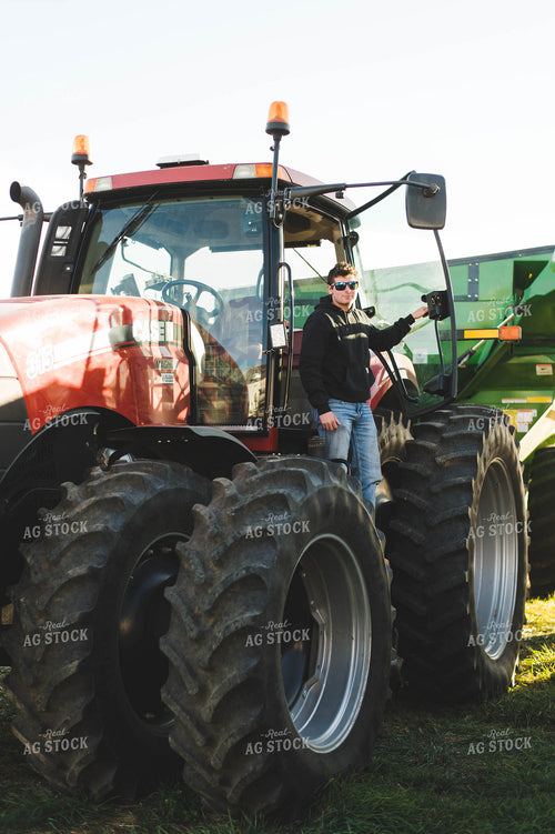 Farmer Exiting Tractor 115013