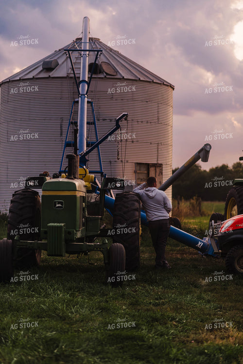 Farmer Leaning on Tractor 115111