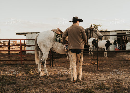 Cowboy Saddling Horse 61179