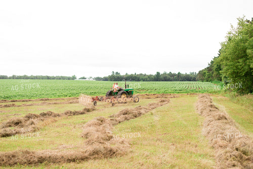 Farmer on Tractor with Hay Rake 74071