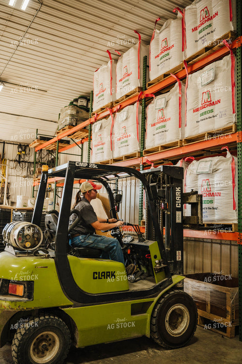 Female Farmer Driving Skid Steer 115238