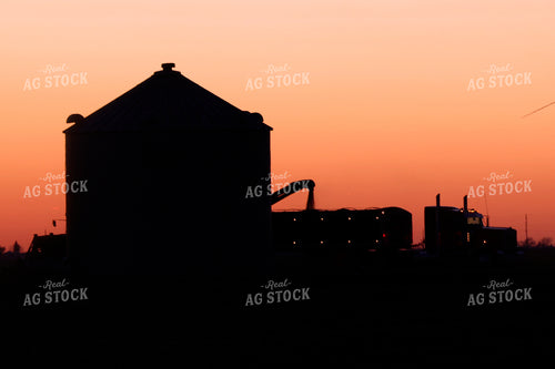 Silhouette of Truck Loading Grain from Bins at Sunset 129109