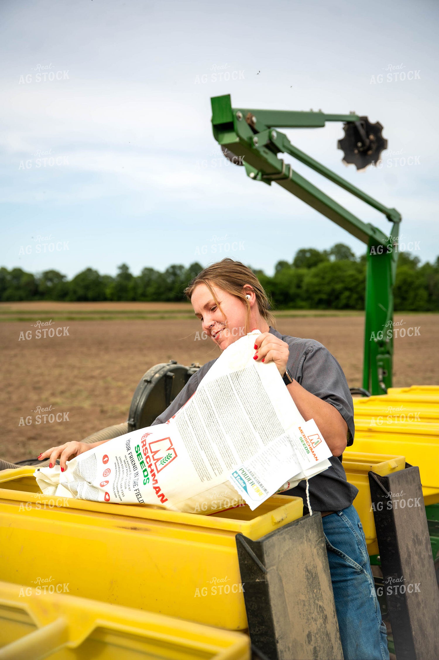 Female Farmer Filling Planter 115632