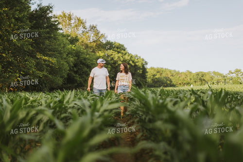 Farmer and Farm Wife Checking Corn 8737