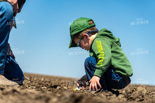 Farmer and Son Checking Seeds 65238