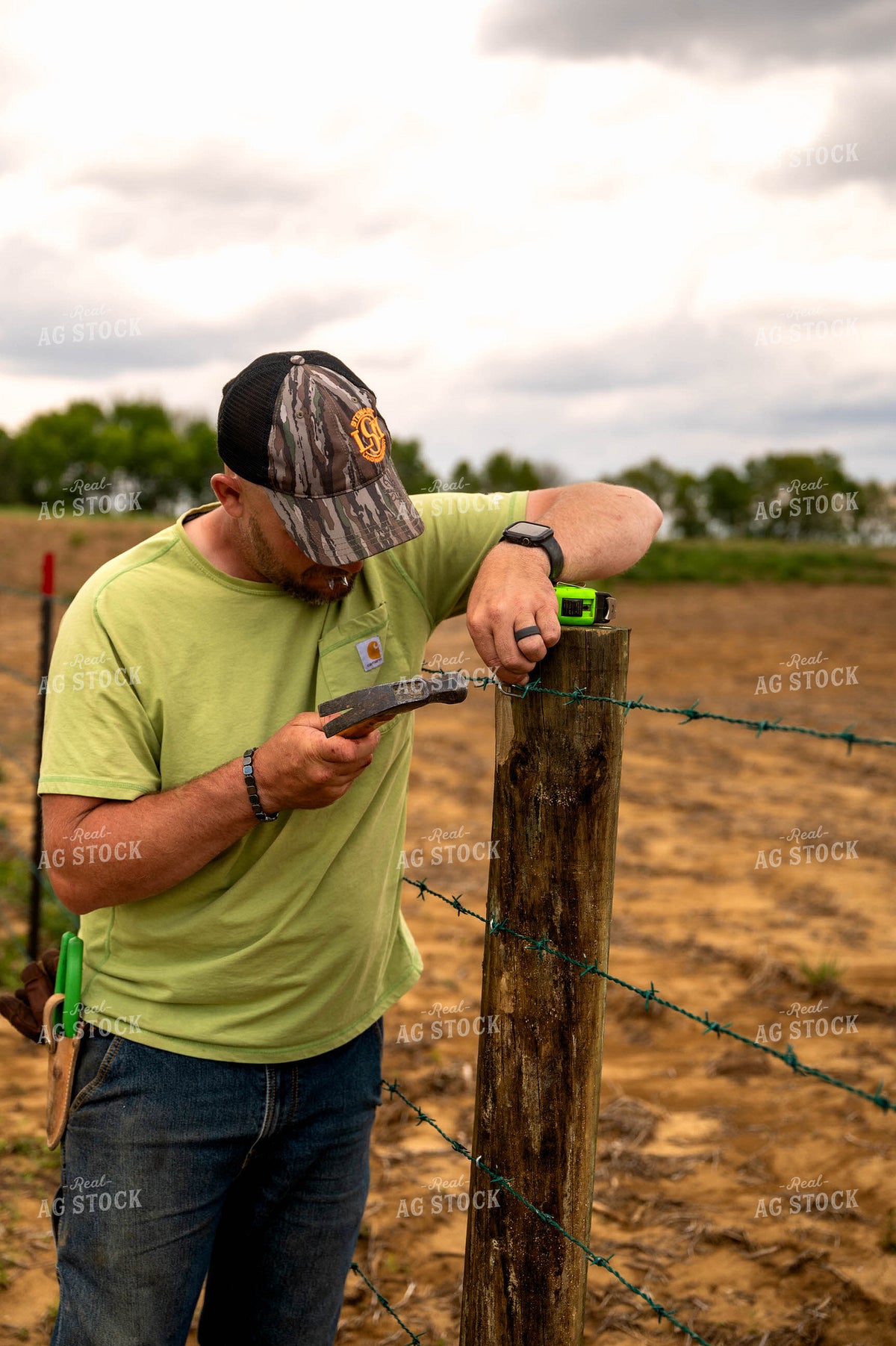 Farmer Building Fence 115923