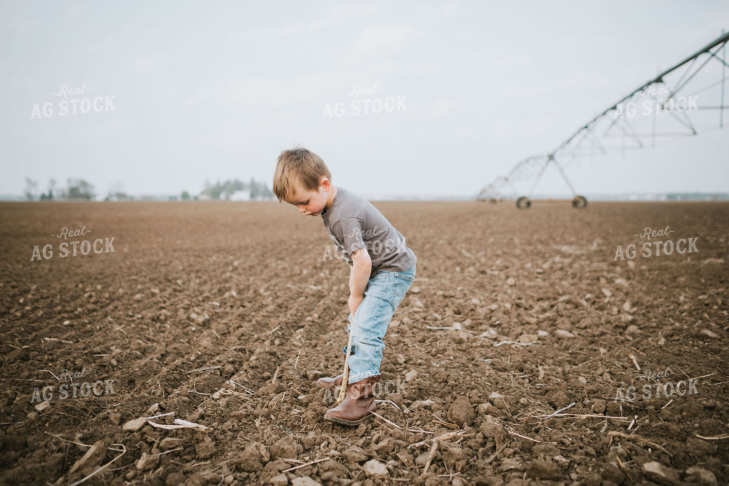 Farm Kid Digging in Soil 5604
