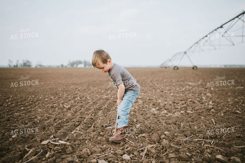 Farm Kid Digging in Soil 5604