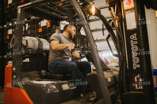 Forklift Operator Unloading Bulk Bins 5339