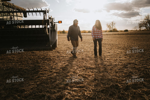 Farmer and Female Farmer Talking Outside of Combine 3523
