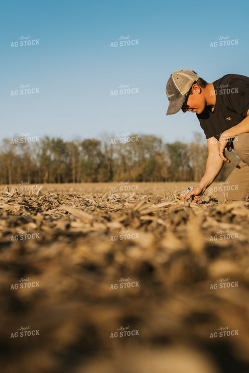 Farmer Checks Seed Depth After Planting 7681