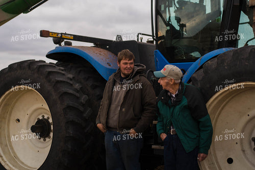 Farmers Standing Near Tractor 115045