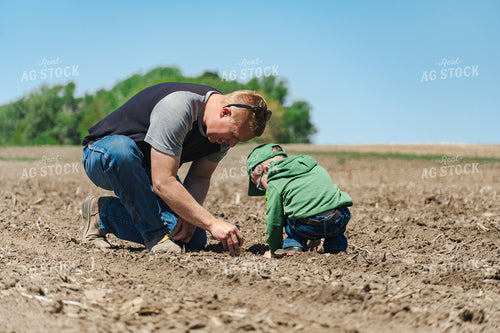 Farmer and Son Checking Seed Depth 65180