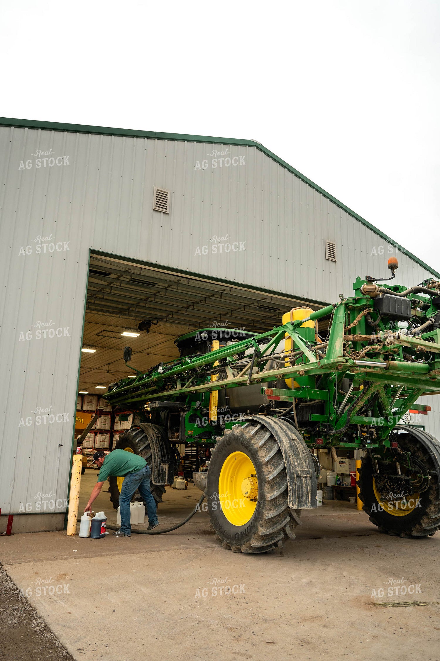 Farmer Filling Self-Propelled Sprayer 115748