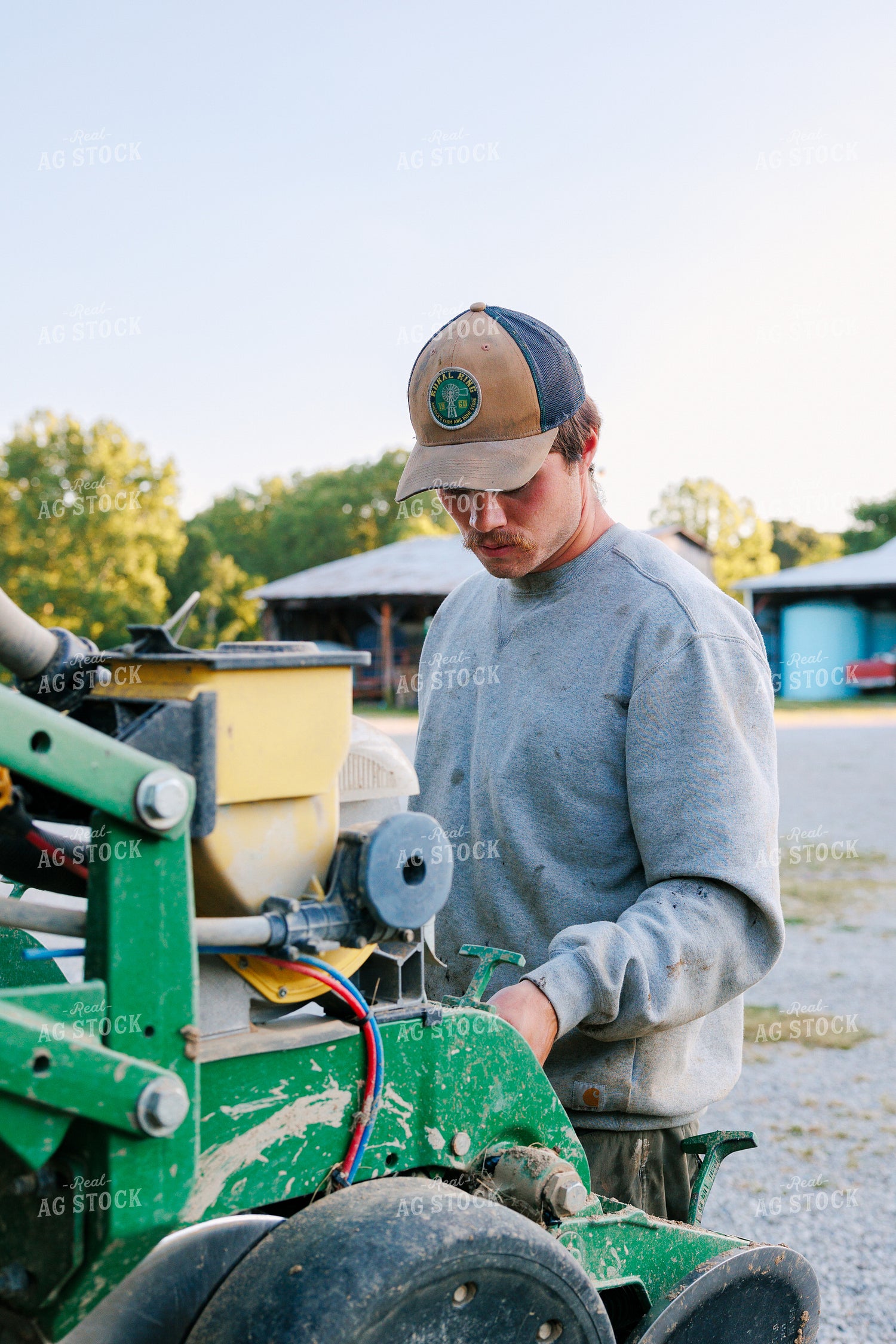 Farmer Preparing the Planter 52785