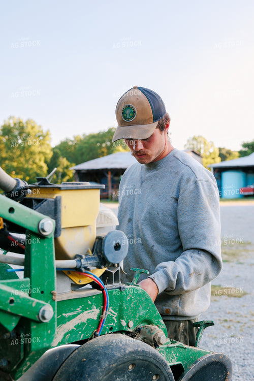 Farmer Preparing the Planter 52785