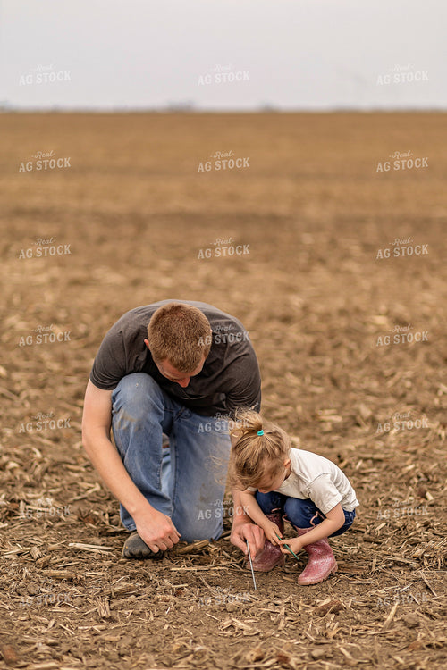 Farmer and Daughter Checking Soybeans 93301