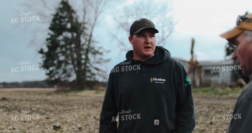 Farmers Talking in Harvested Field 3994