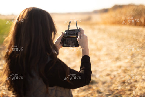 Female Appraiser Flying Drone 9444