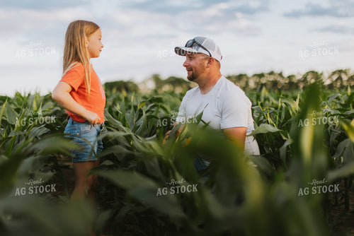 Farmer and Daughter Checking Corn 8809