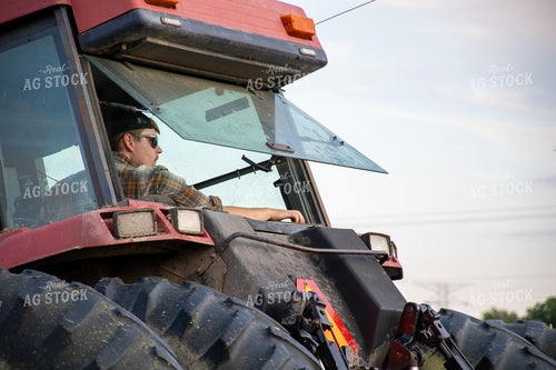 Farmer in Tractor 50232