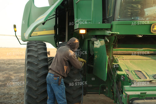 Farmer Blowing out Combine 114100