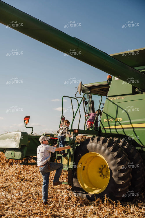 Farm Kids and Dad Climbing in Combine 115354