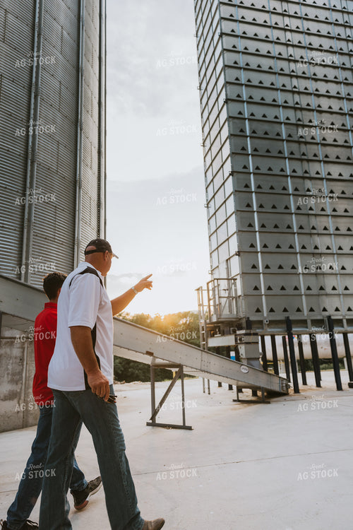 Farmers Walking by Grain Leg 7793