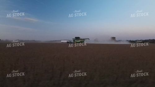 Aerial of Soybean Harvest with Trucks and Combine at Sunset 7382