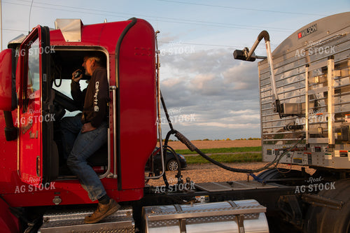 Farmer Talking on Radio in Semi Cab 25690