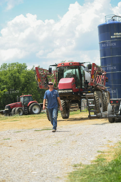 Farmer Walking by Sprayer 191229