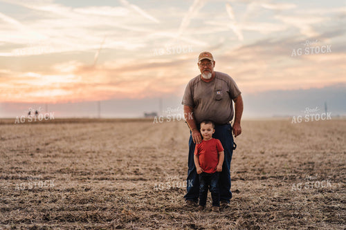 Farmer and Farm Kid in Field 115041