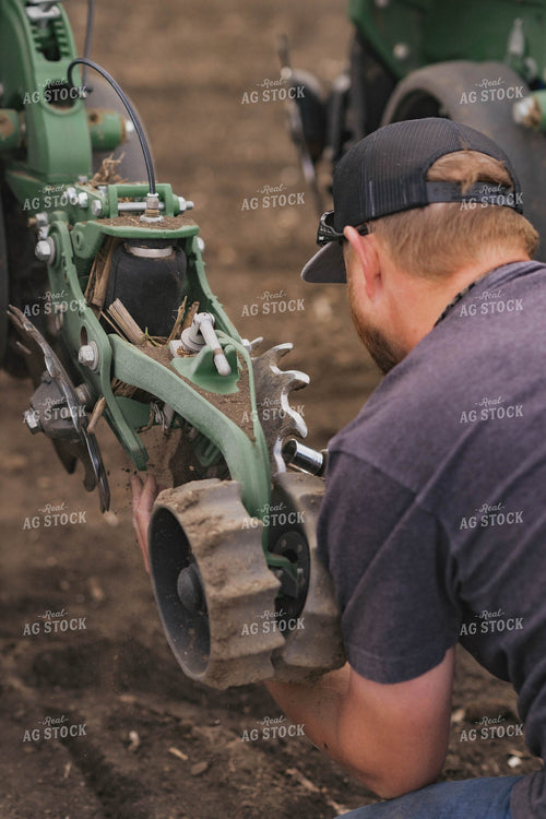 Farmer Repairing Planter 91009