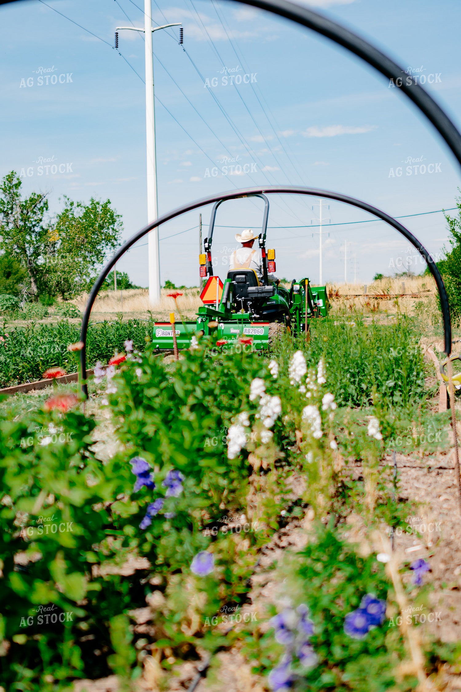 Farmer Moving Around Raised Garden Beds 218055