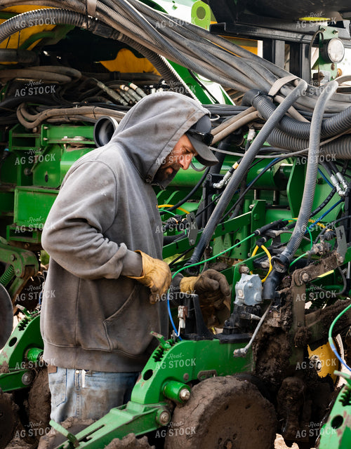 Farmer Working on Planter 185224