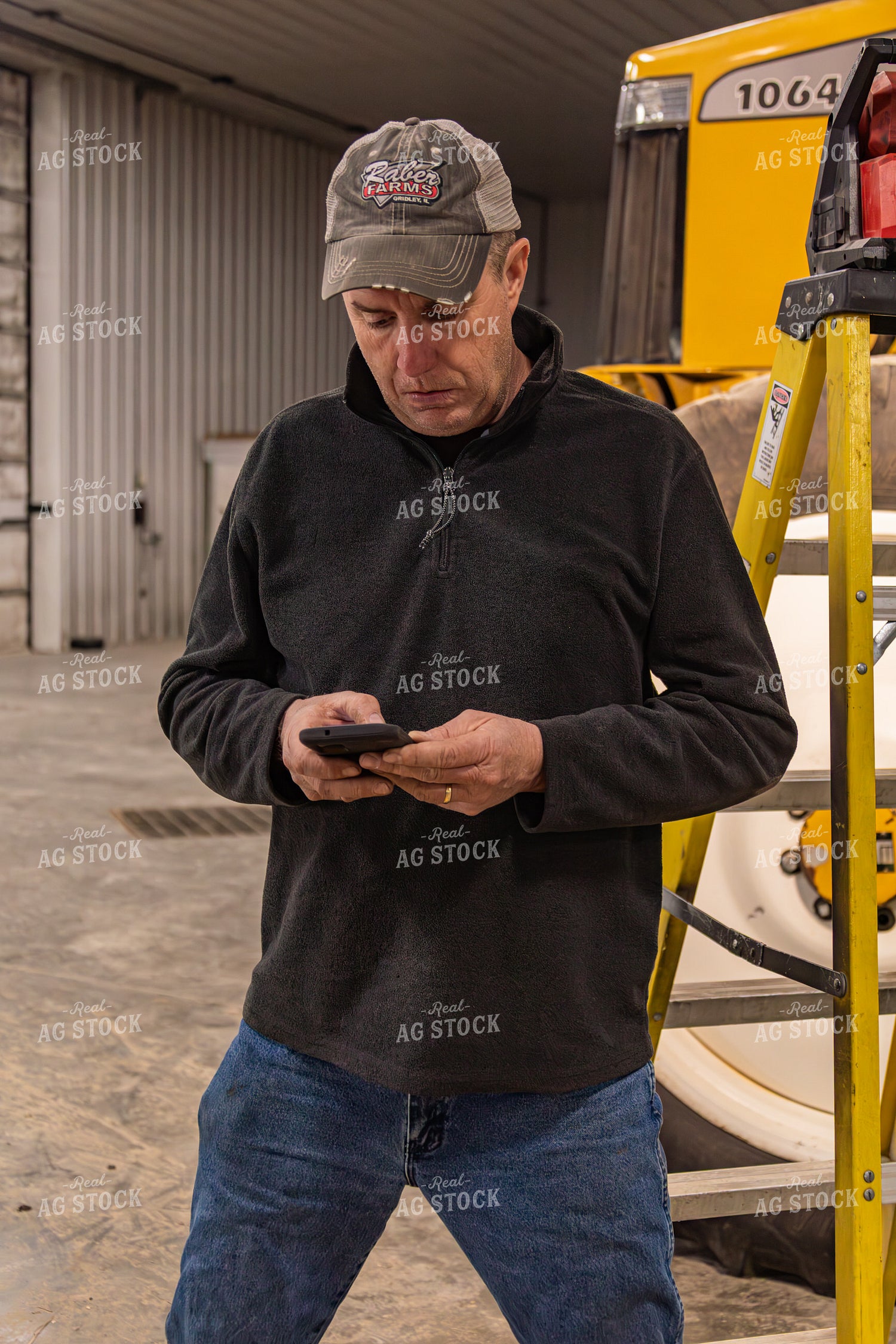 Farmer Using Phone in Shop 231118