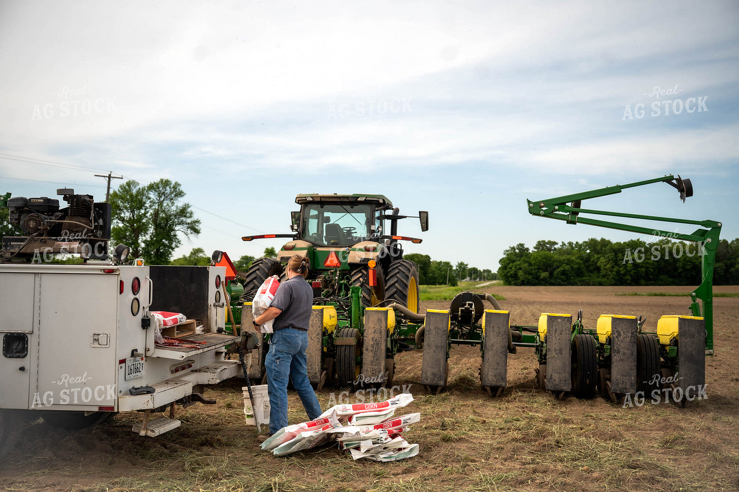 Female Farmer Filling Planter 115639