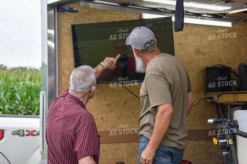 Farmers Looking at Field Map 84127