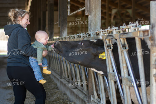 Female Farmer and Son with Holstein 50483