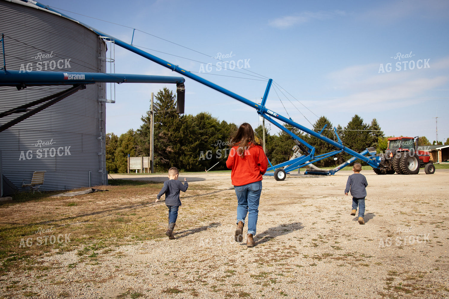 Farm Family Walking by Grain Bins 268098