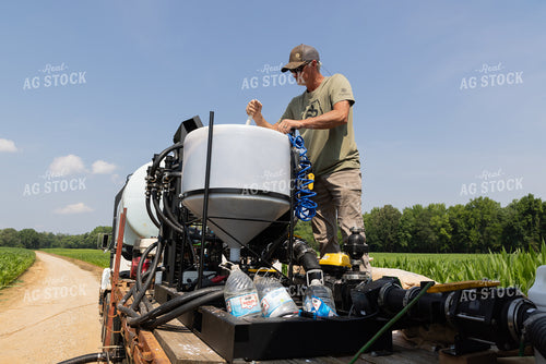 Farmer Mixing Chemicals 79823