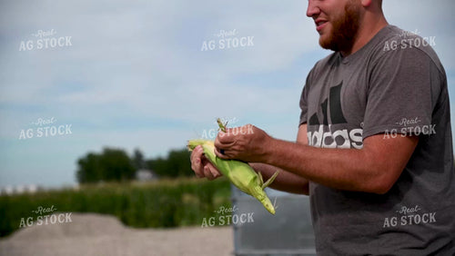 Family Shucking Sweet Corn - 255