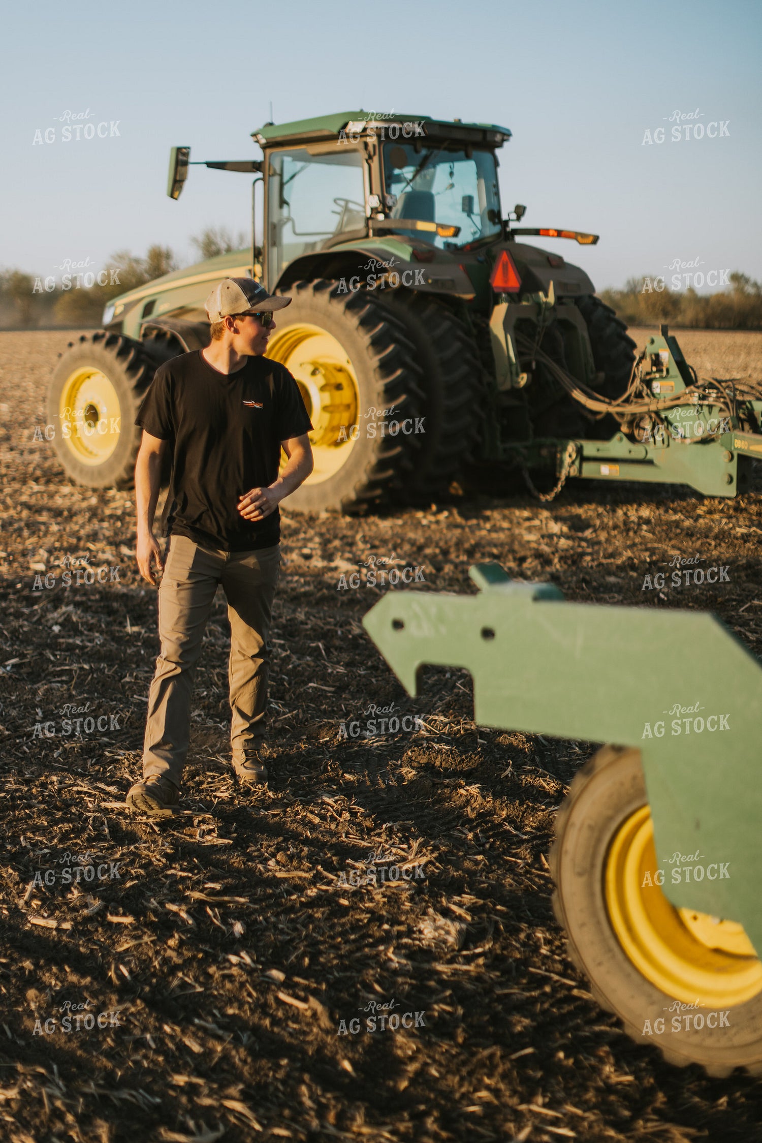 Young Farmer Walks Away from Tractor 7698