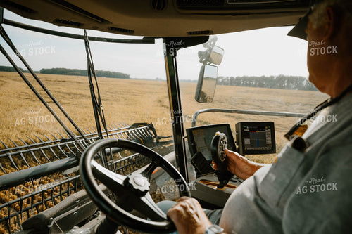 Farmer Operating Combine 125185