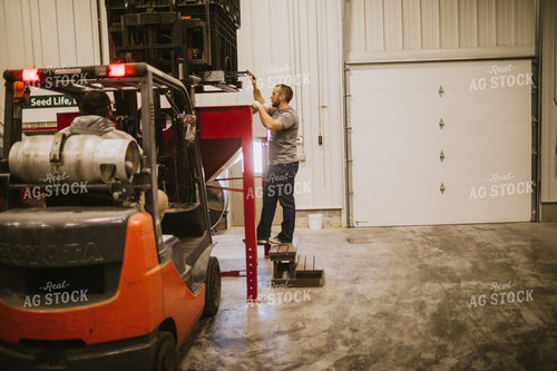 Forklift Operator with Dumping Soybean Bulk Bin 5291
