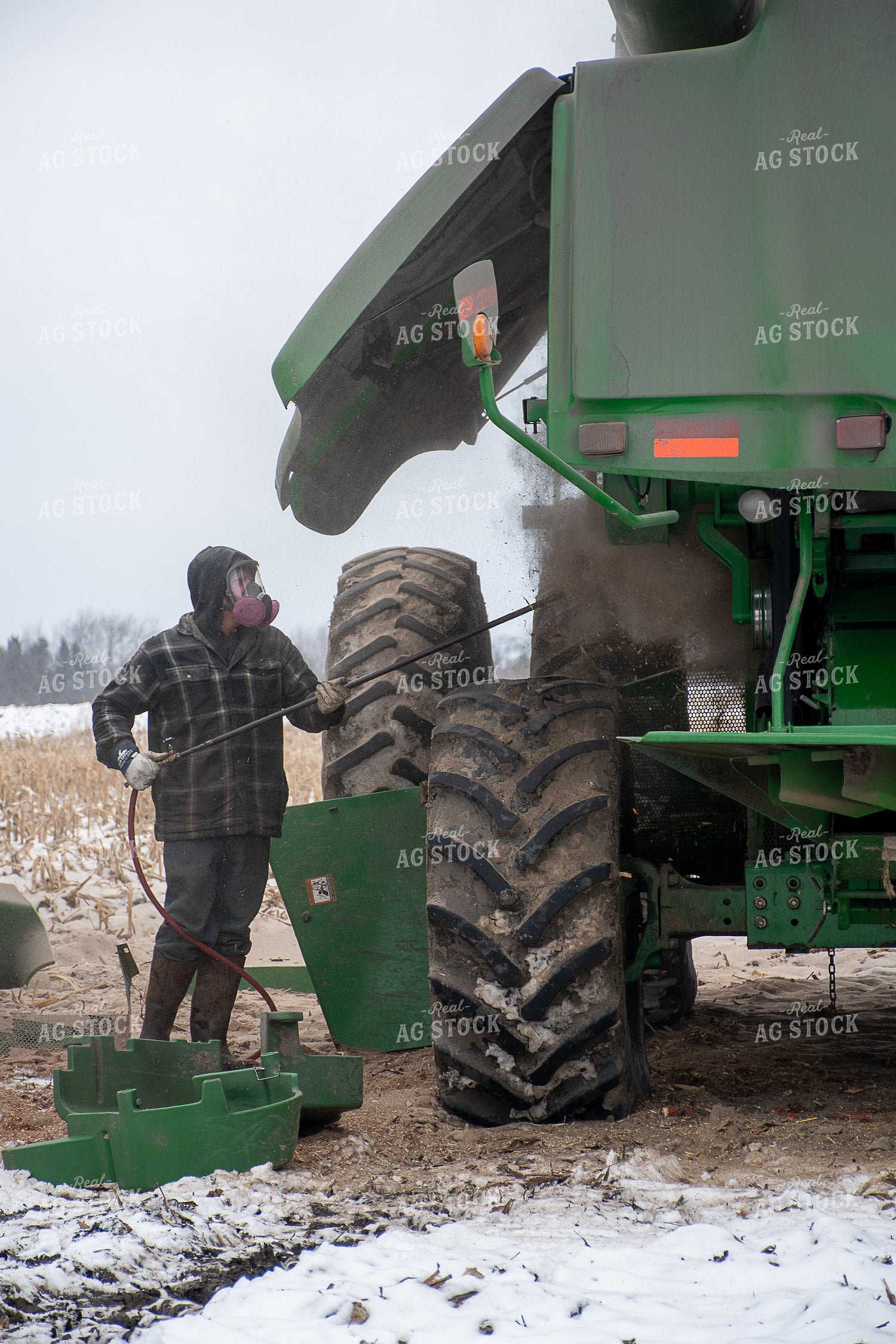 Farmer Cleaning Combine 50460