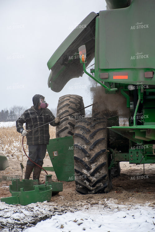 Farmer Cleaning Combine 50460